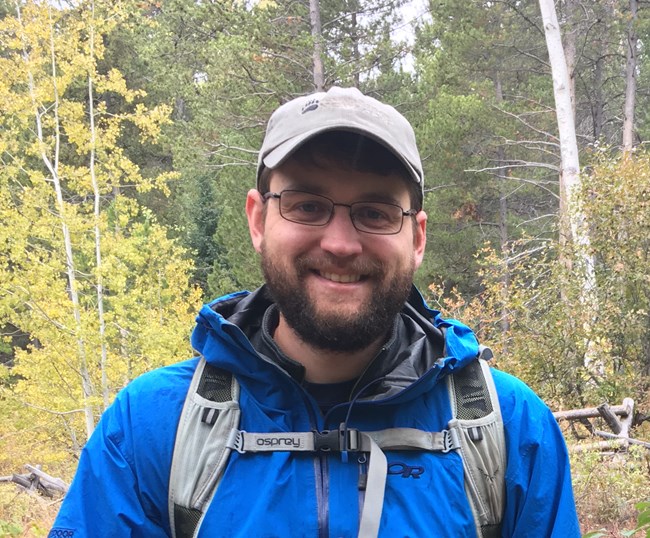 Andrew White enjoys a hike on a rainy day in Grand Teton National Park