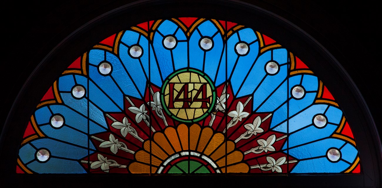 Close up of stained glass window above doorway