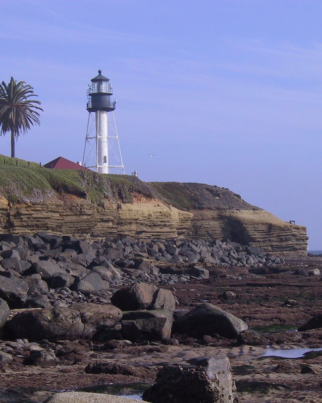 lighthouse and coastal bluff