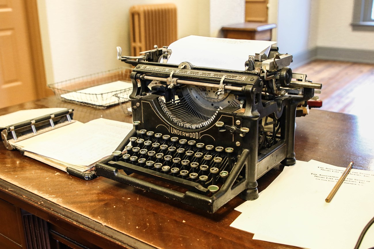Typewriter and papers on a desk