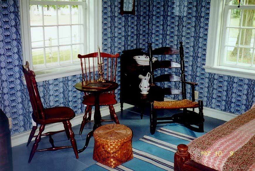 Photo of the inside of a parlor with three wooden chairs. 9Courtesy of the Prudence Crandall Museum, administered by the Connecticut Historical Commission, State of Connecticut)