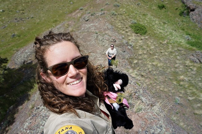 ranger taking a selfie with a stuffed pup