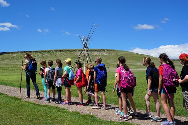 Ranger leading school children on a hike