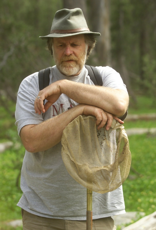 Gary standing outside with a dip net.