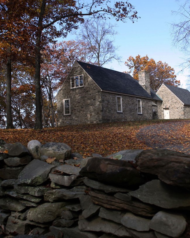 stone wall and cottage