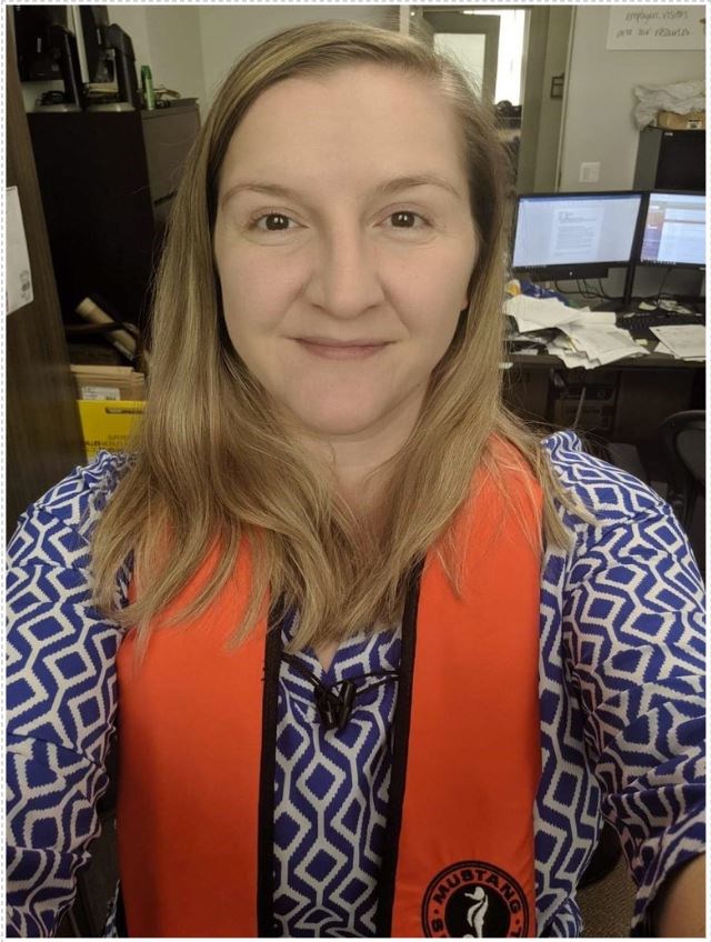 Ina Hysi wearing a life jacket in an office