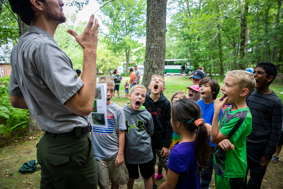 Park ranger with a group of children