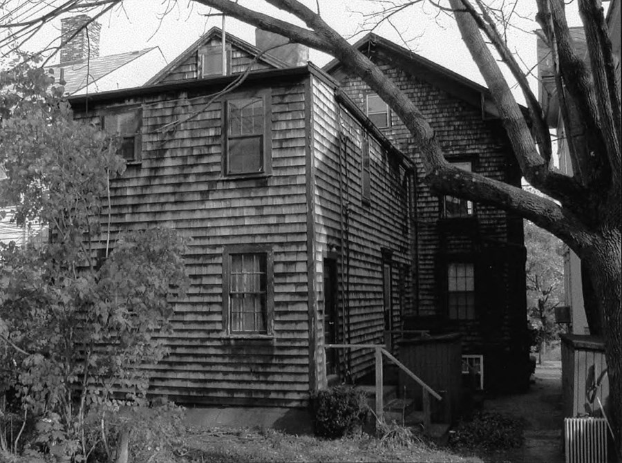 Black and white image of side of the house
