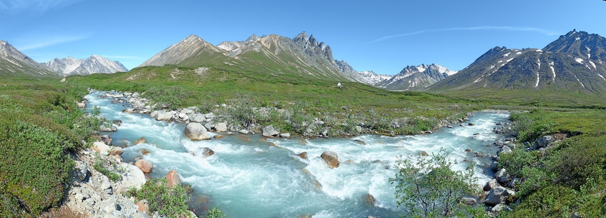 A panorama of a river with many rocks