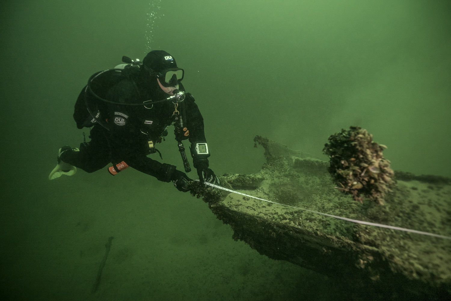 divers assess underwater resource