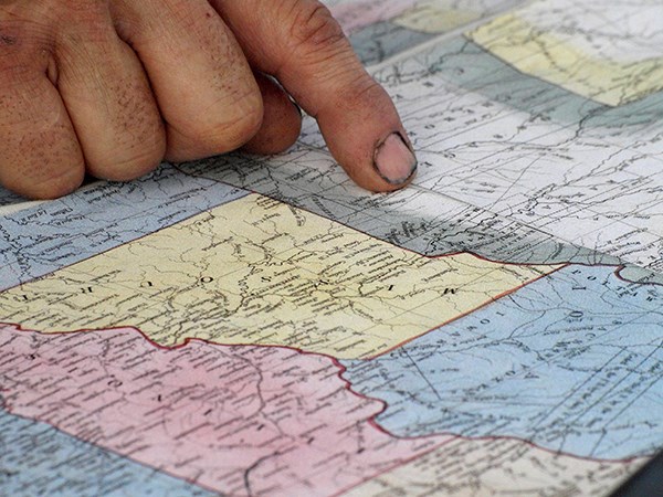 map of Missouri with someone pointing finger