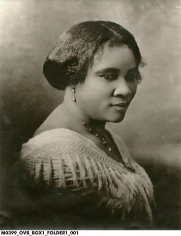 Madam C.J. Walker seated in partial profile turned towards her right