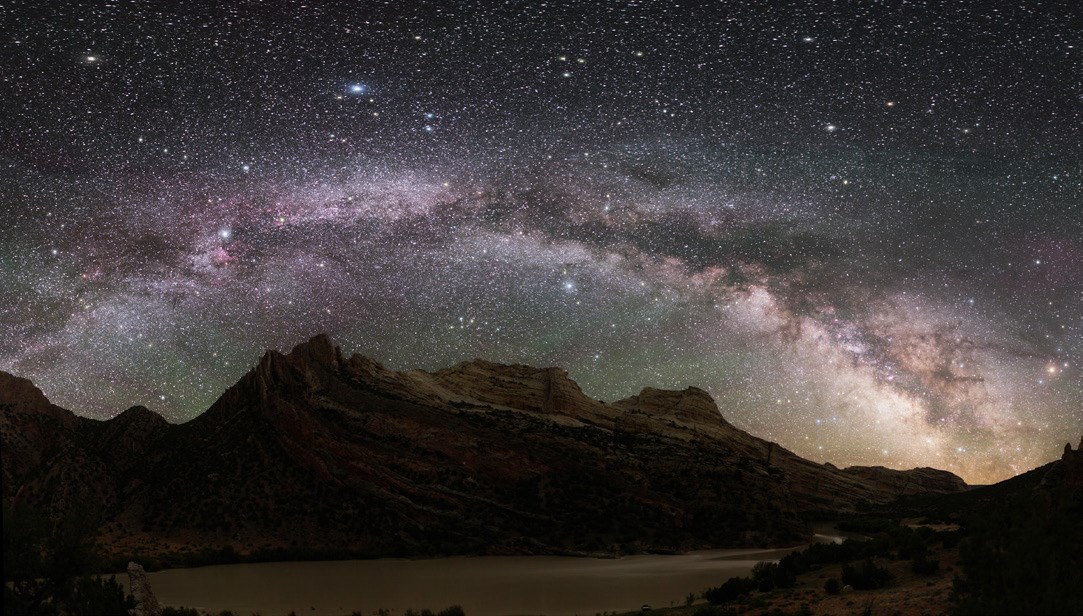 Full arc of the Milky Way framing rock formations below. Photo by NPS / Dan Duriscoe