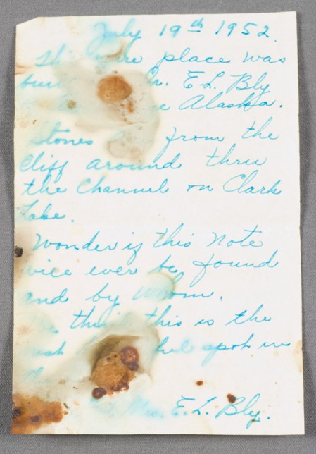Image of a note, handwritten in blue ink.