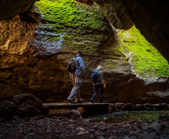 hikers in talus cave