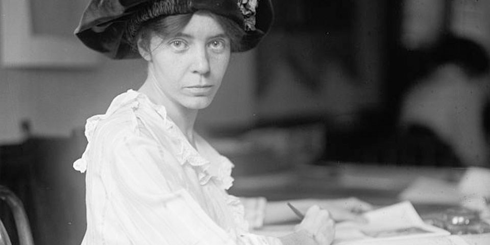 Black and white photo of Alice Paul, a young woman in a hat.
