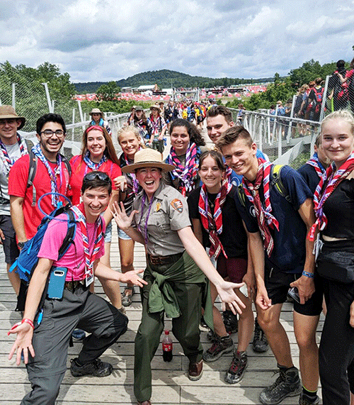A park ranger with several scouts