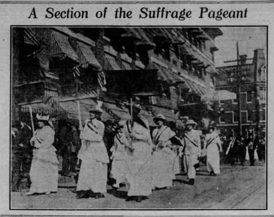 Newspaper photo of women marching in suffrage procession
