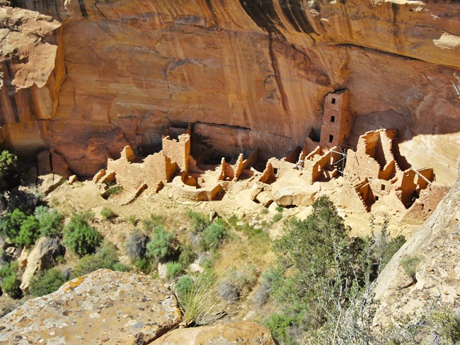 Photo of dwellings carved out of stone.