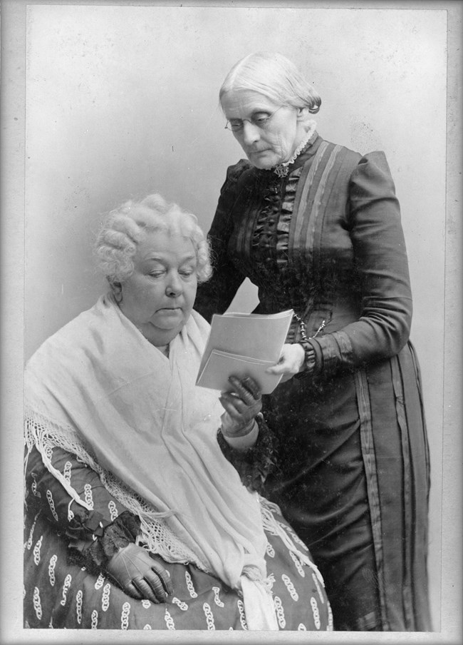 Susan B Anthony and Elizabeth Cady Stanton reviewing document