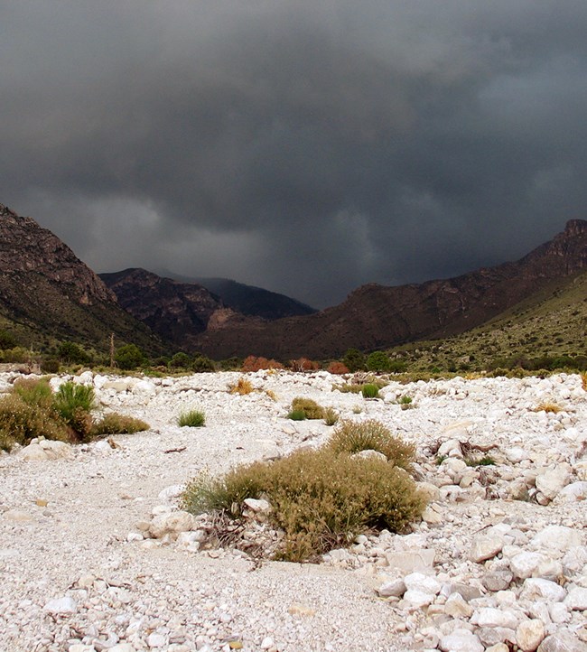 Dark storm clouds over mountains