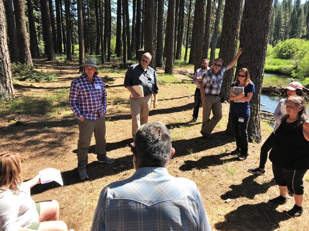 Ken Holbrook (pictured in the hat) leads the workshop design team on a tour of the site, National Park Service photo.