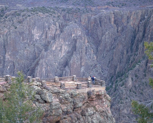 Park visitors looking at Black Canyon from Gunnison Point