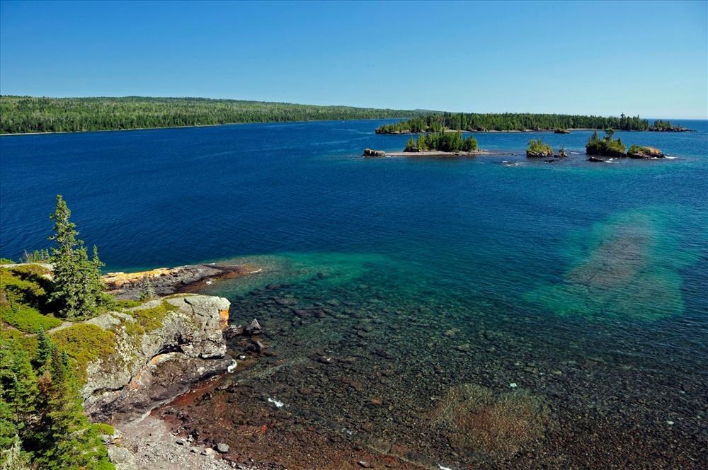 blue lake with green islands.