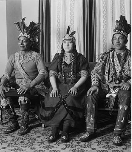 Three native americans seated