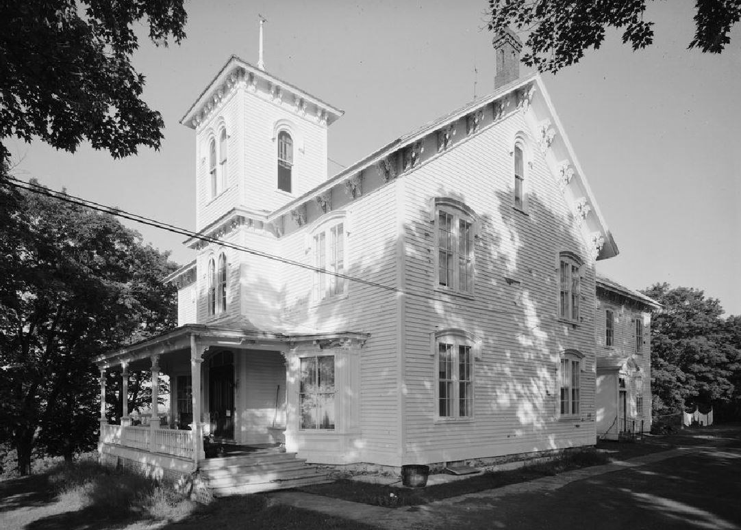 Two-story house with turret.