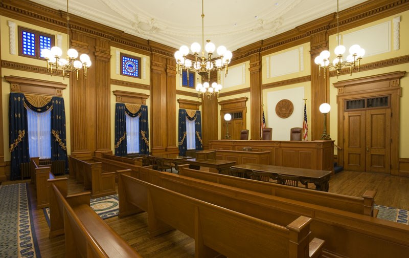 Inside of courtroom with benches. (General Services Administration)