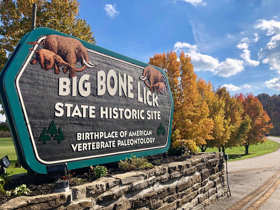 The entrance sign to Big Bone Lick State Historic Site, describing it as the “birthplace of American vertebrate paleontology”. Mastodons are depicted on the sign as well.