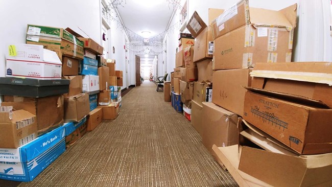 Boxes line a hallway in the Main Interior Building