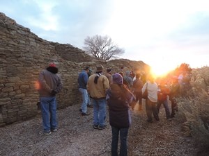 Visitors observing winter solstice sunset with a ranger.