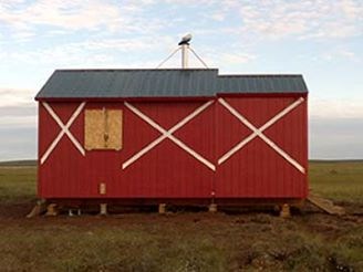 red cabin on tundra