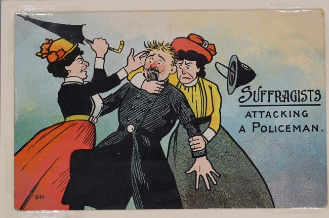 Postcard  labeled No. 641, with a colorful cartoon illustration of one woman restraining a police officer while another woman hits him with an umbrella.