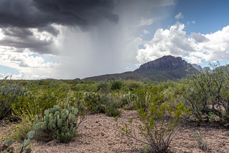 A localized thunderstorm drenches a small part of the desert.