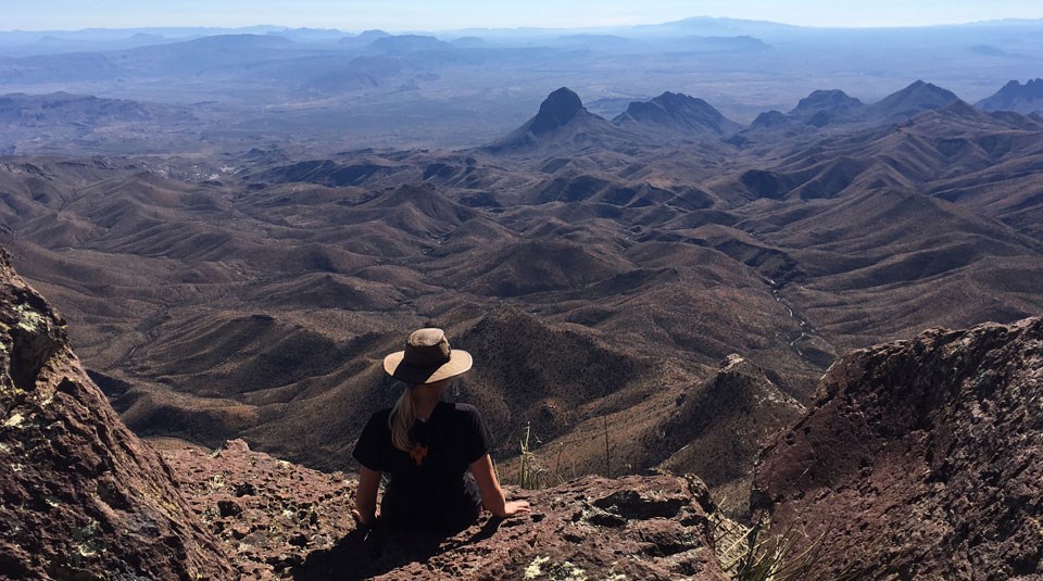 Hiker enjoying the view from the South Rim of the Chisos.