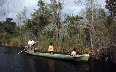 seminole_woman_and_child_dugout_canoe_along_tamiami_trail_1_1
