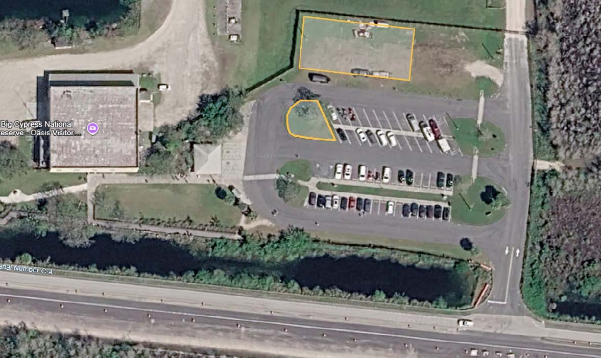 Two areas highlighted near the parking lot for the Oasis Visitor Center. One cone-shaped area is in a grassy area in the top left part of the lot. The other is a rectangular area just above the top lot.