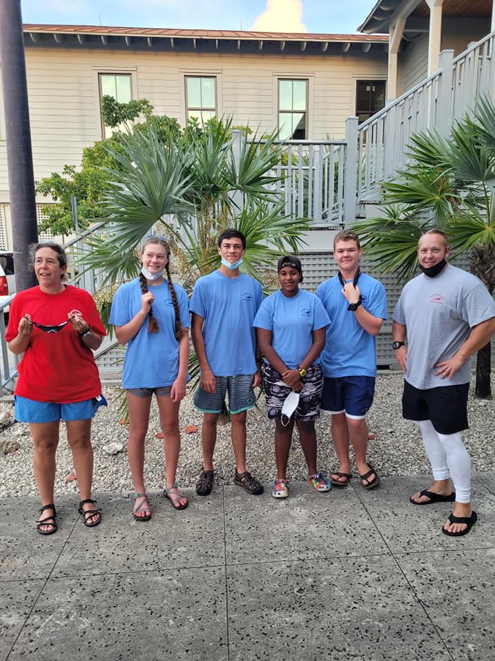 Group photo of four teens and two adults