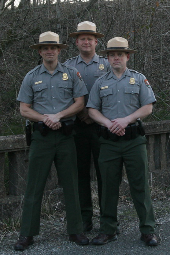 Three park rangers in uniform