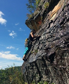 Visitor rock climbing