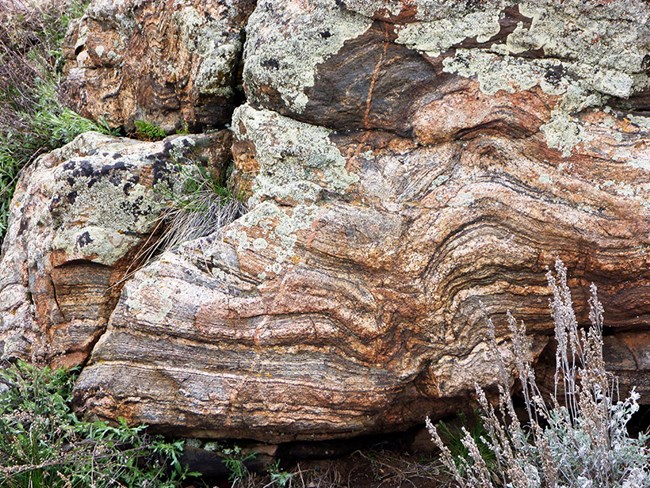 example of gneiss, a rock with dark and light stripes or bands