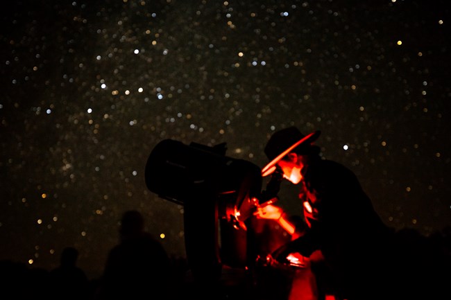 Ranger looking through telescope