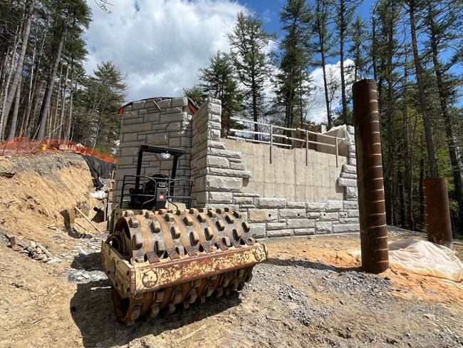 Stone masonry in progress on Laurel Fork Bridge North abutment.