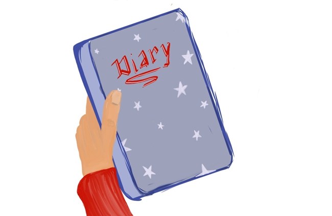 an image of a hand holding a diary