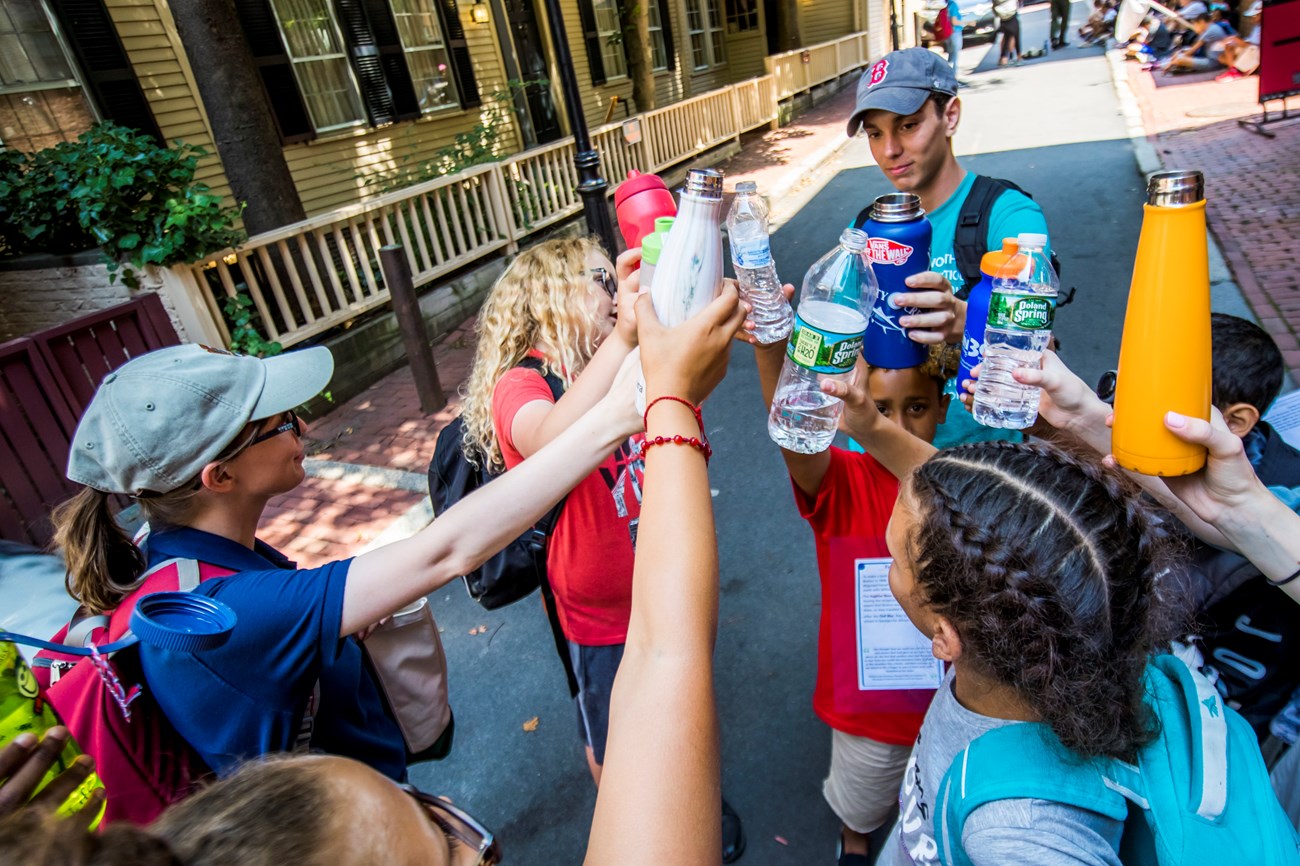 group of kids clinking their water bottles in Smith Court.