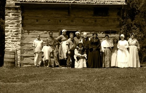 Living History Guild in front of the Kitchen Cabin