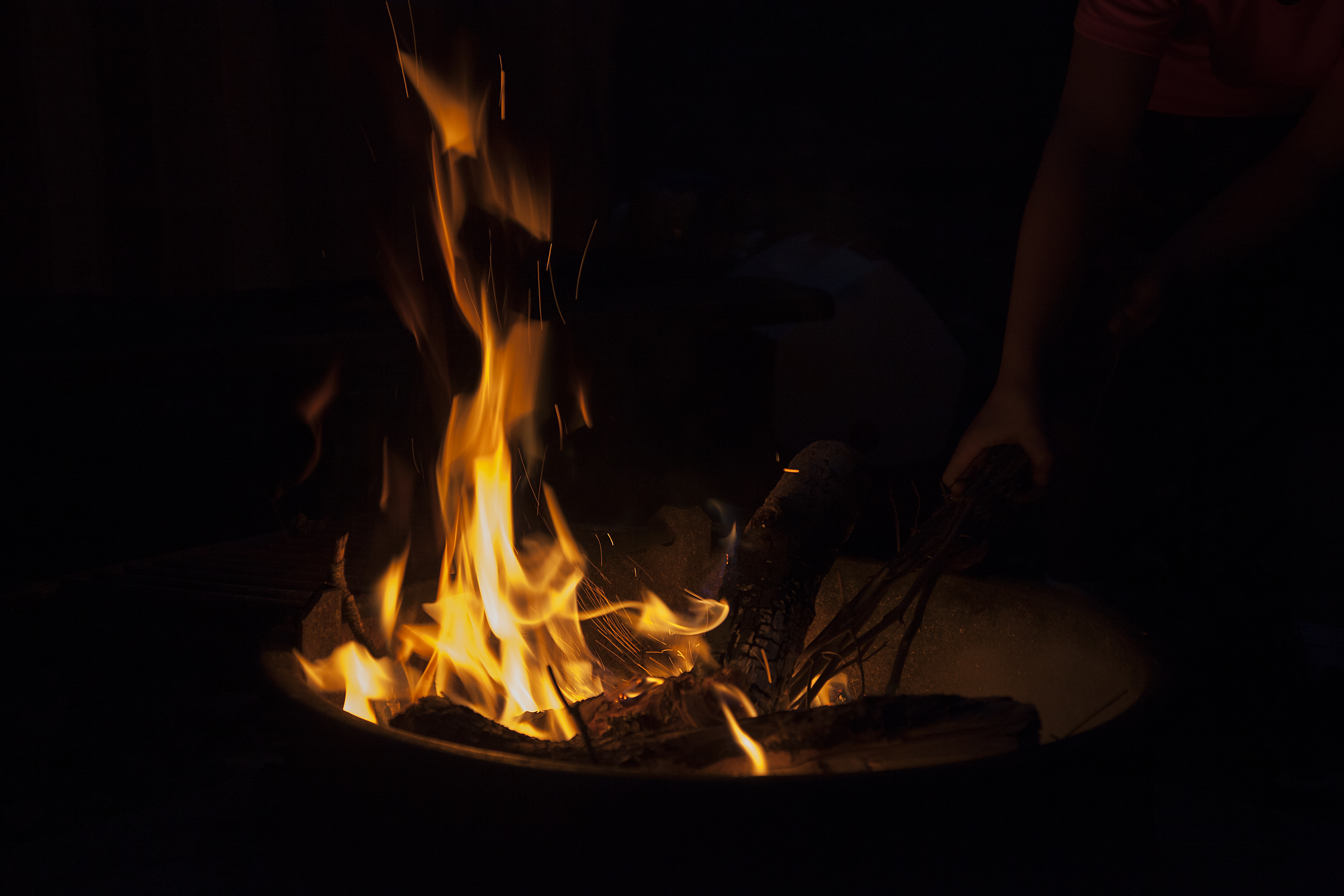 Red and orange flames glow against a black background